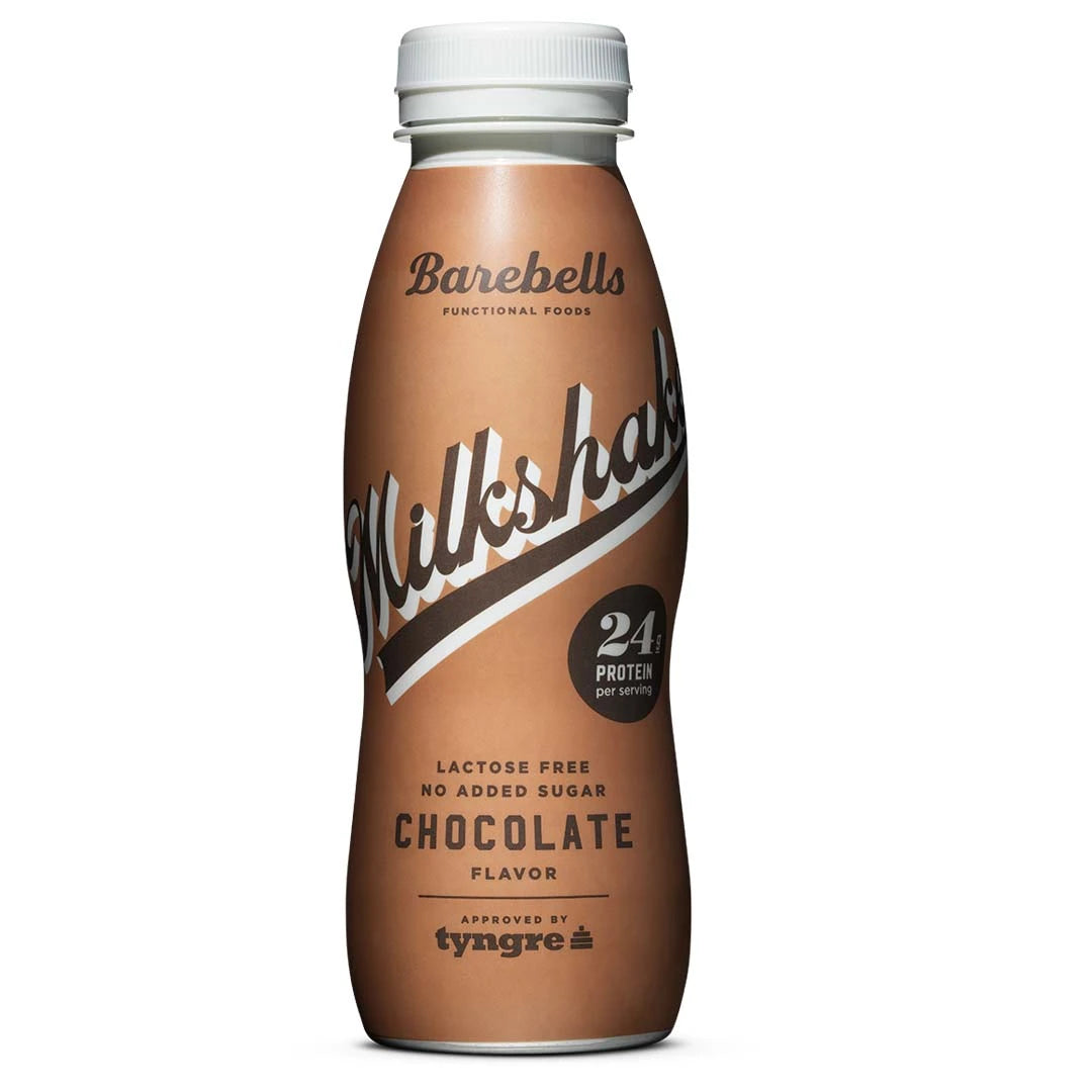 Barebells Milkshake 330 ml proteindryck i en brun flaska med vit kork för smaken Chocolate.