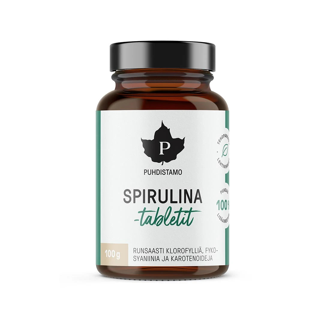 Puhdistamo Spirulinatabletit 100 g i en mörk burk med vit etikett och gröna detaljer.