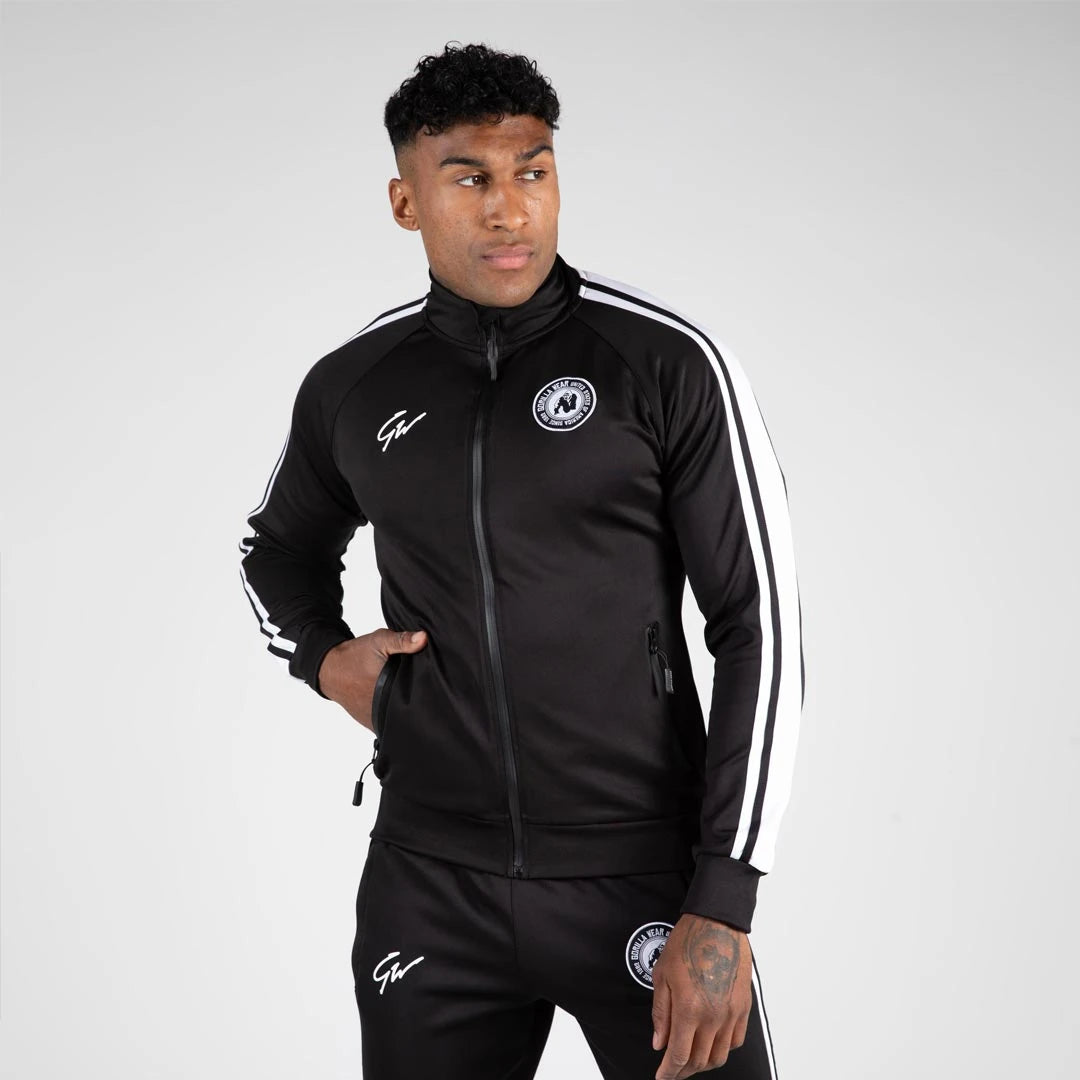 Gorilla Wear Stratford Track Jacket Black, en svart träningsjacka med vita ränder på ärmarna och broderad logotyp., bild 4 av 6