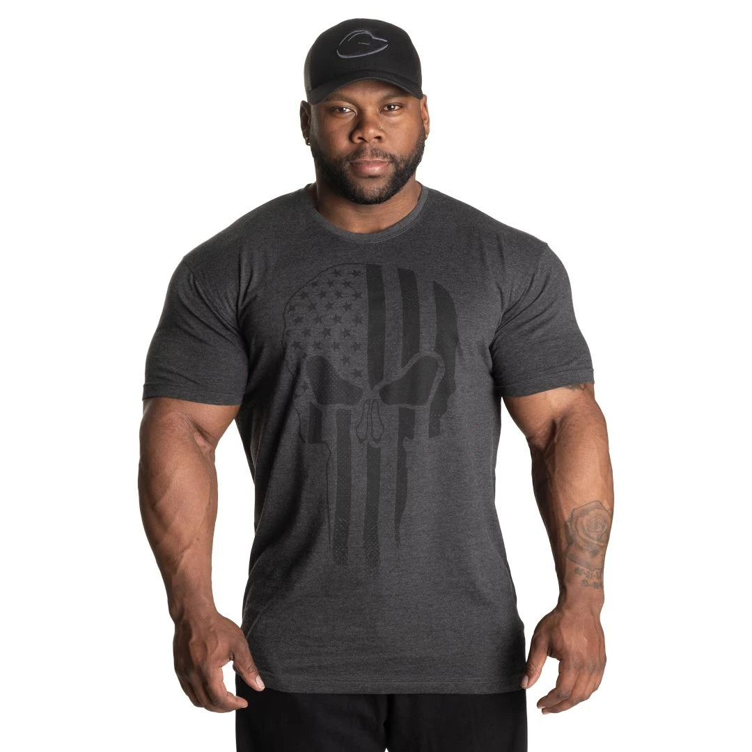 GASP Skull Standard Tee Dark Grey Melange, en mörkgrå melerad t-shirt med ett svart dödskalletryck på bröstet., bild 1 av 8