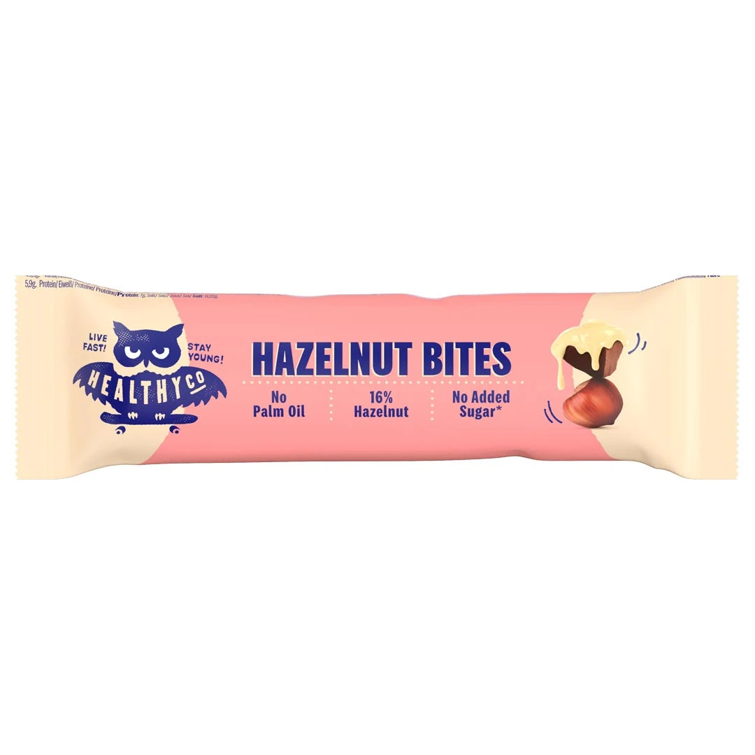 Healthyco Hazelnut Bites 21 g chokladbit i en rosa och ljusbeige förpackning med mörkblå text.