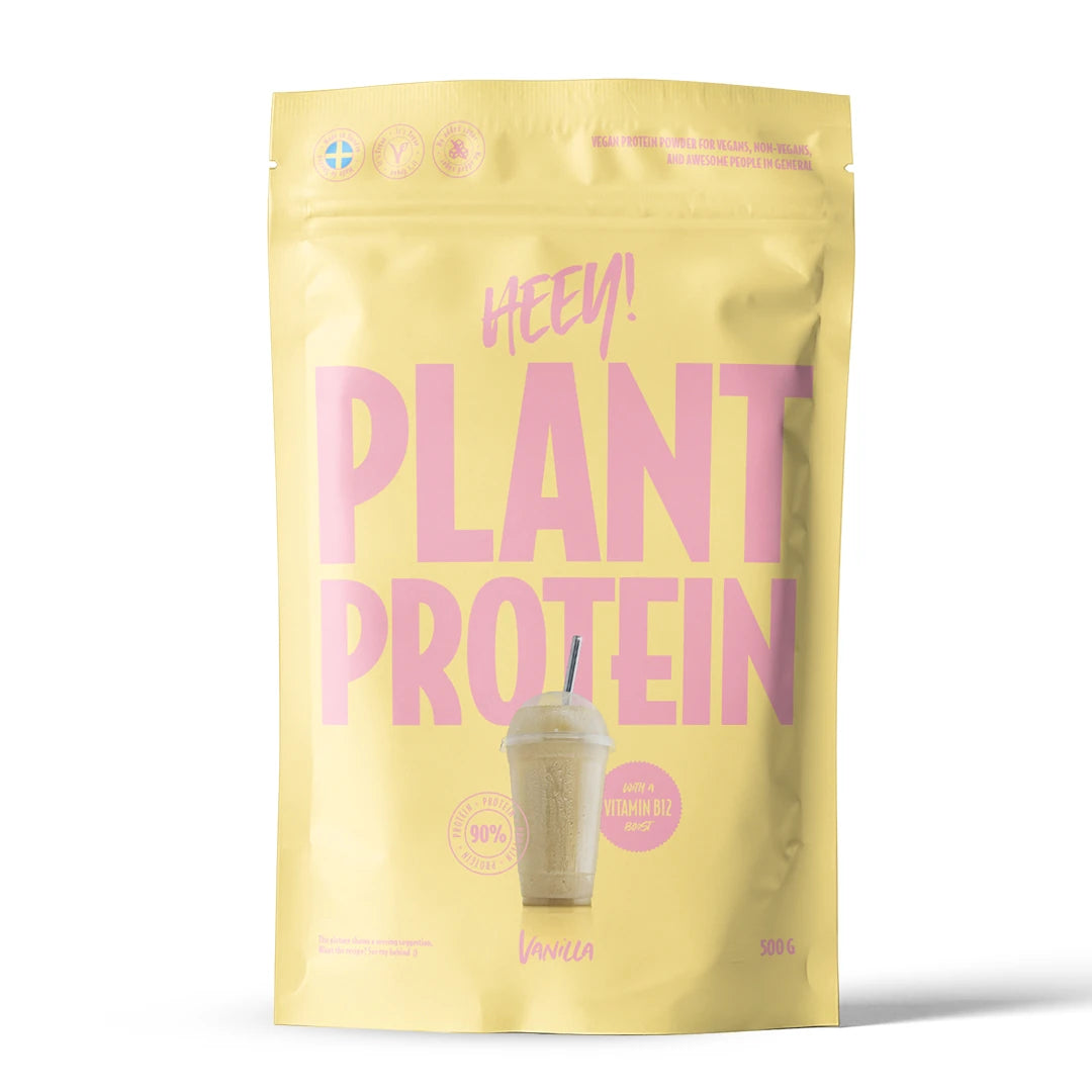 Heey! Veganskt Protein 500 g proteinpulver i en ljusgul påse med rosa text för smaken vanilj., bild 3 av 9