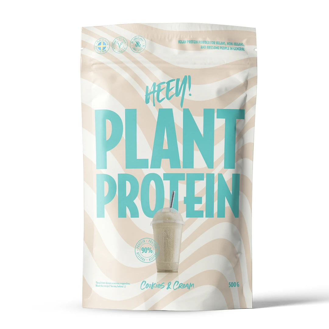Heey! Veganskt Protein 500 g i en beige och vit vågig påse med turkos text för smaken Cookies &amp; Cream., bild 4 av 9