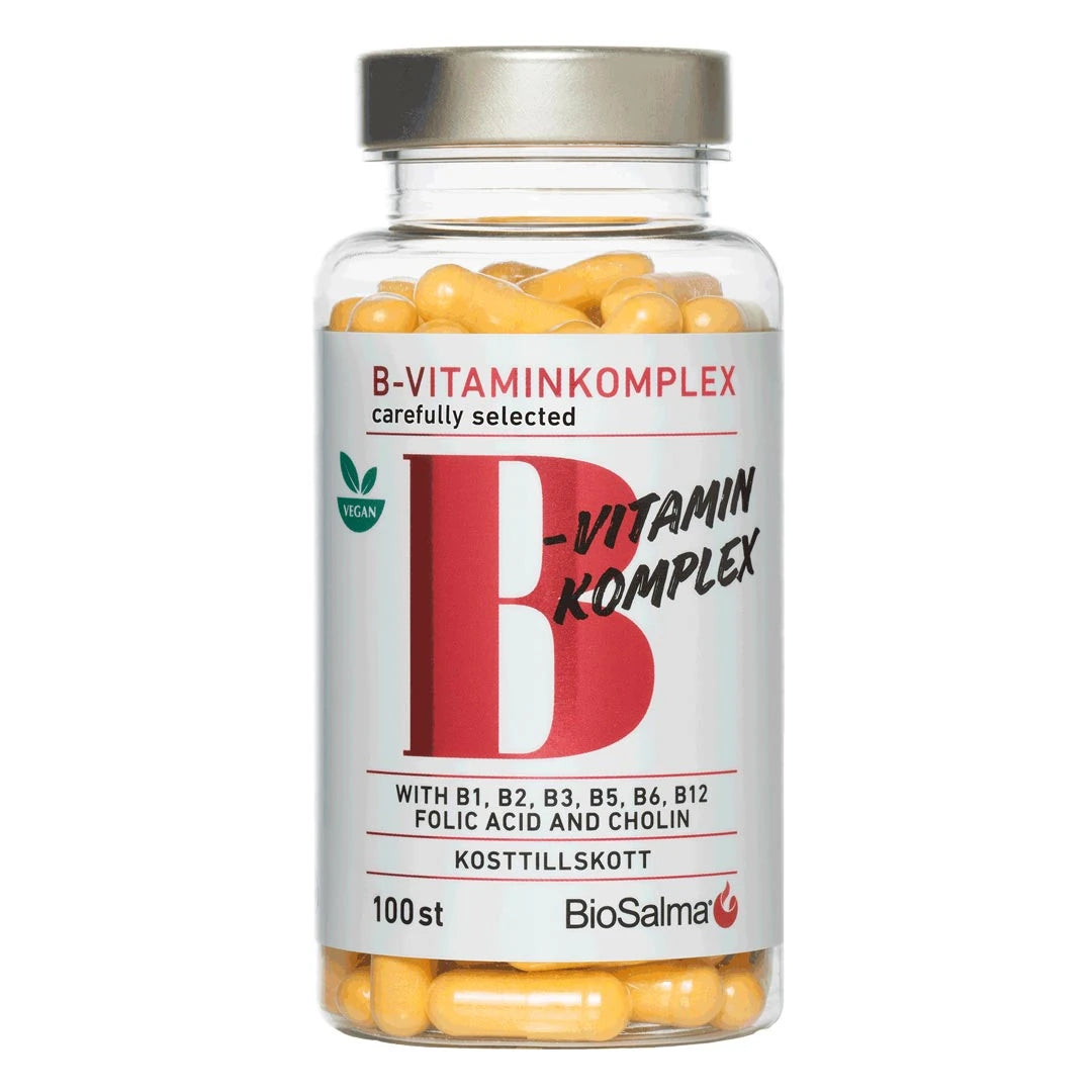 BioSalma B-vitamin Komplex 100 caps i en genomskinlig burk med silverlock, vit etikett och gula kapslar.