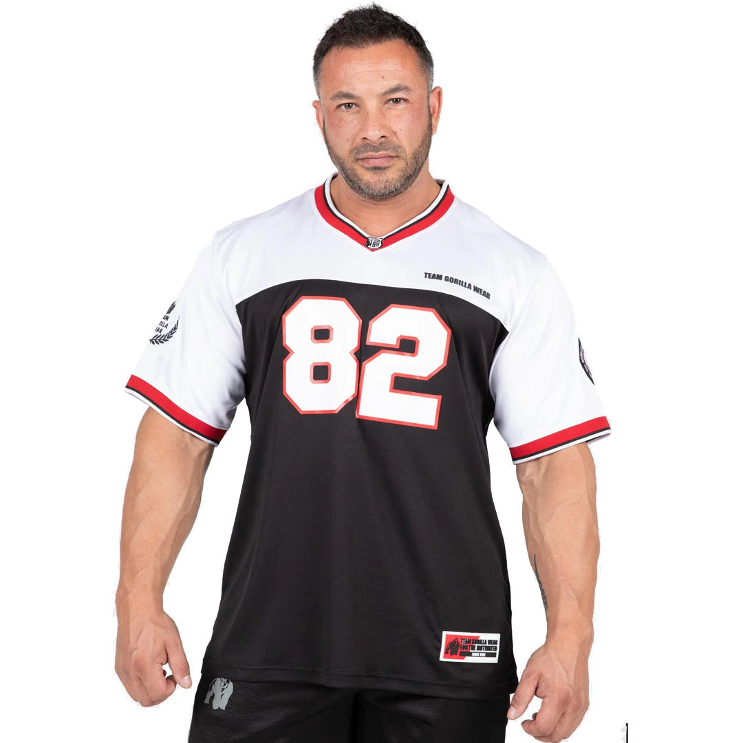 Gorilla Wear Trenton Football Jersey Black/White är en svartvit t-shirt i polyesternät med v-ringning och 82-tryck., bild 1 av 8