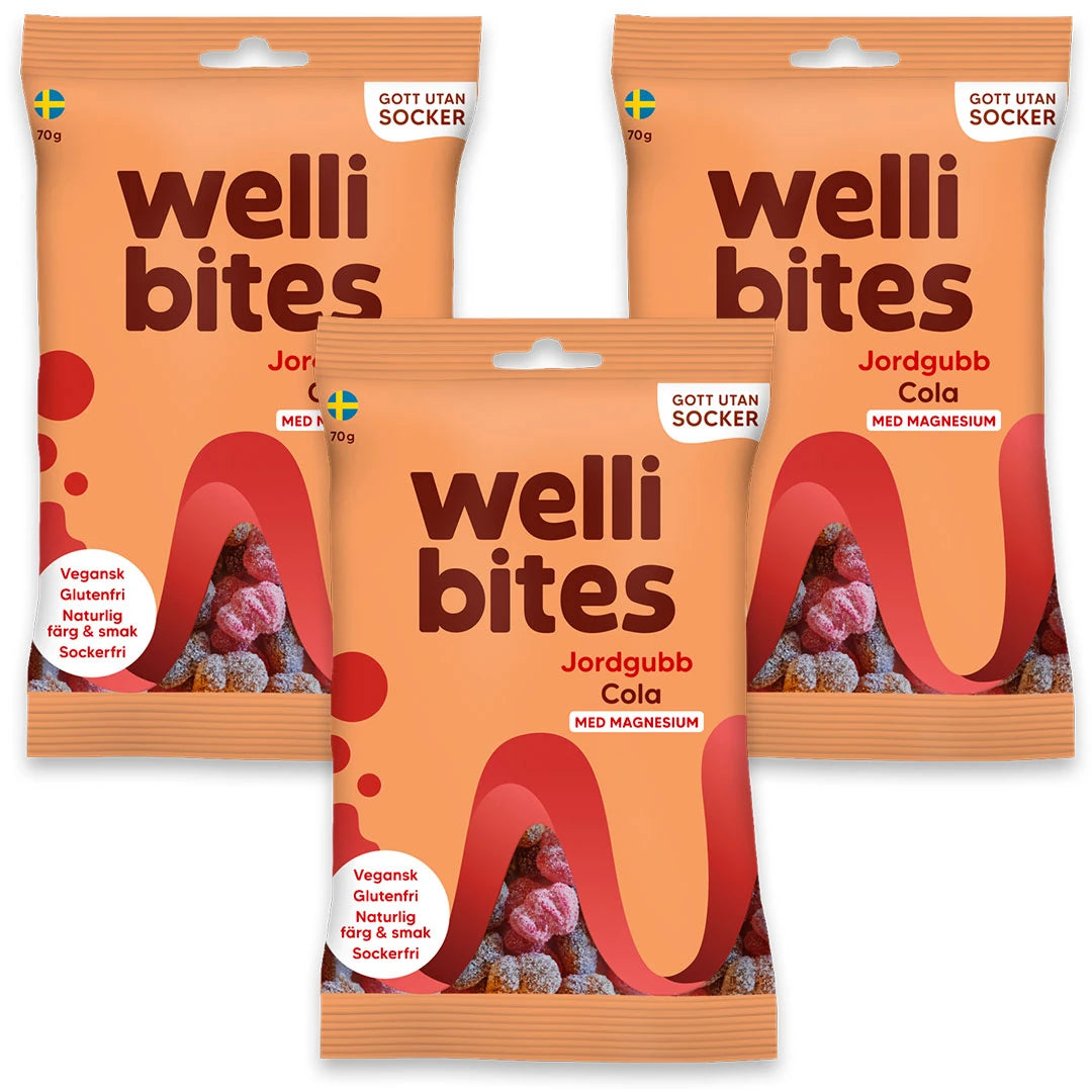 3 x Wellibites Candy 70 g Jordgubb & Cola i tre ljust orangea godispåsar med röda och svarta detaljer.