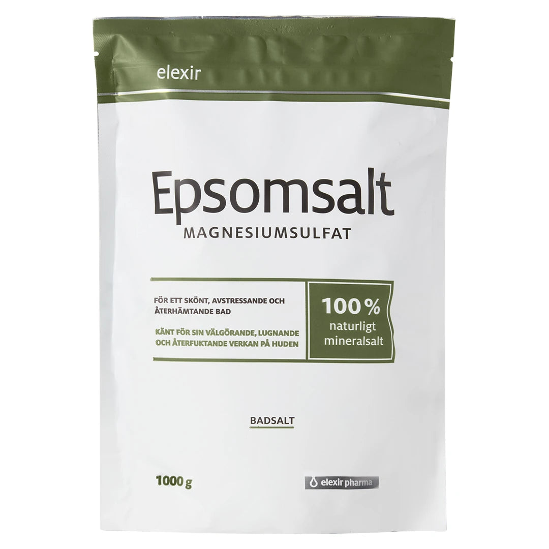 Elexir Pharma Epsomsalt 1kg i en vit påse med olivgröna detaljer, ett naturligt mineralsalt för avkopplande bad.