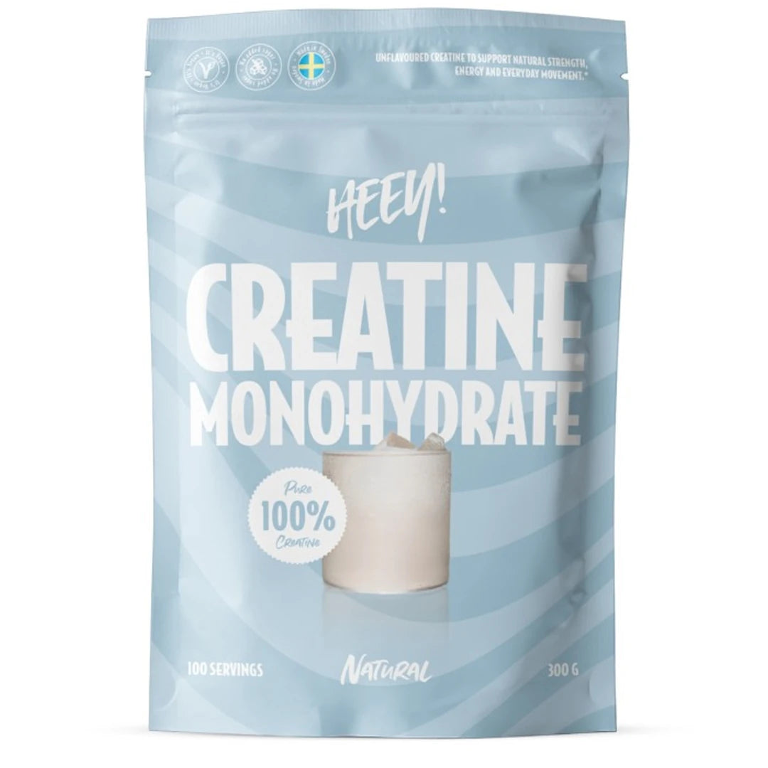 Heey! 100% Creatine Monohydrate 300 g i en ljusblå randig påse med smak Natural.