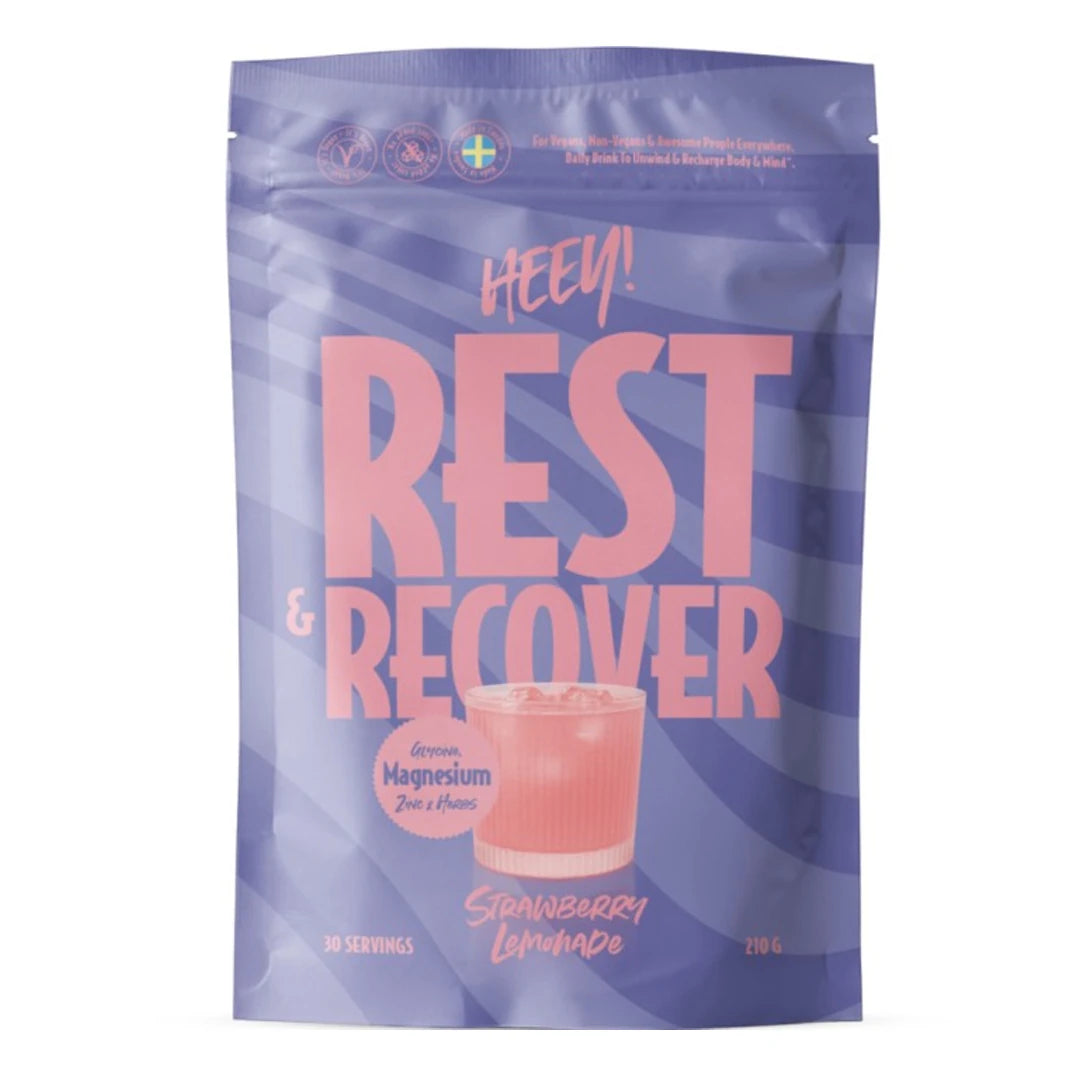 Heey! Rest & Recover Magnesium 210 g pulver i en lila påse med rosa detaljer och smaken Strawberry Lemonade.