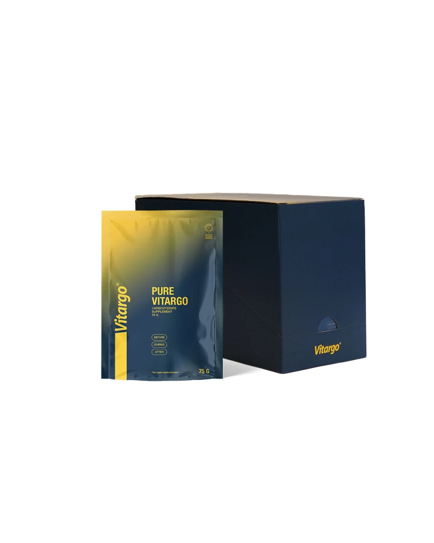 Vitargo Pure 15 x 75 g kolhydrater förpackade i en mörkblå låda med en portionspåse framför i gult och blått.