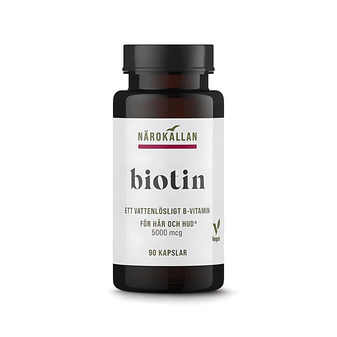 Närokällan Biotin 5000 mcg 90 caps, ett veganskt kosttillskott i en mörkbrun burk med vit etikett.