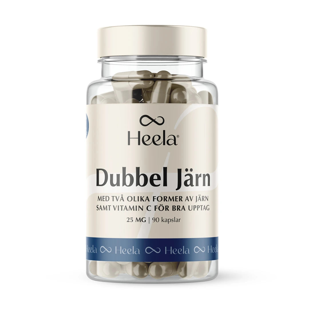 Heela Dubbel Järn 25 mg 90 caps kosttillskott i en genomskinlig plastburk med beige och blå etikett, fylld med kapslar.