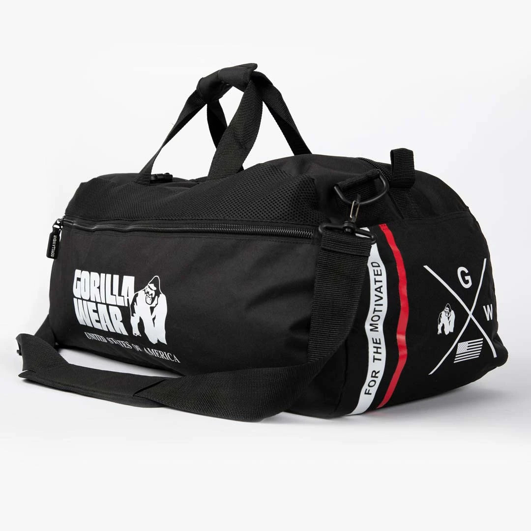 Gorilla Wear Norris Hybrid Gym Bag/Backpack Black, en rymlig svart träningsväska i polyester med vita och röda detaljer.