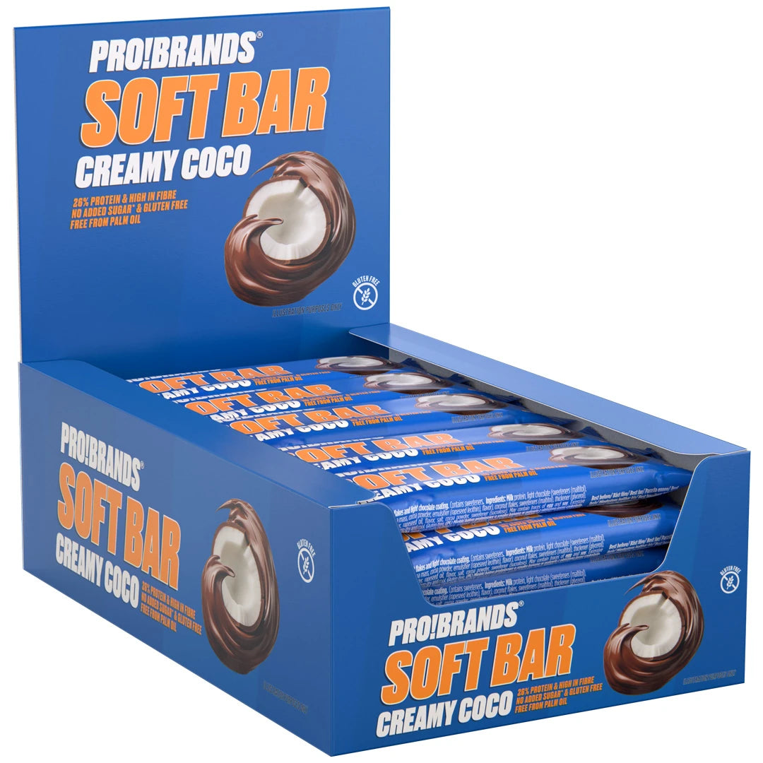 15 x Pro Brands Softbar 40 g Creamy Coco i en blå låda fylld med proteinbars i blått omslag med en bild av kokos och choklad.