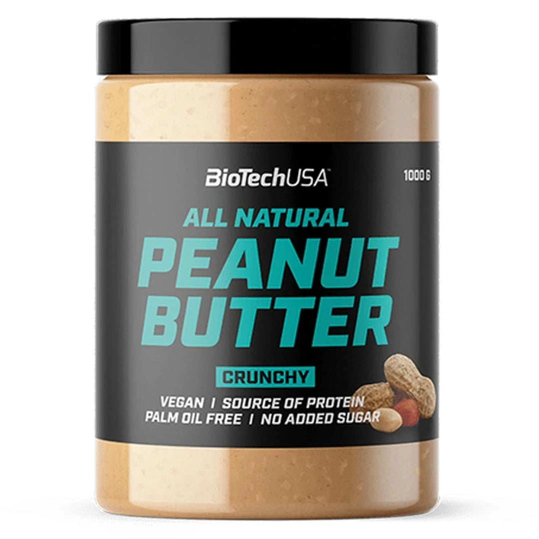 BioTechUSA Peanut Butter 1 kg i en genomskinlig burk med svart etikett och turkos text för varianten Crunchy.
