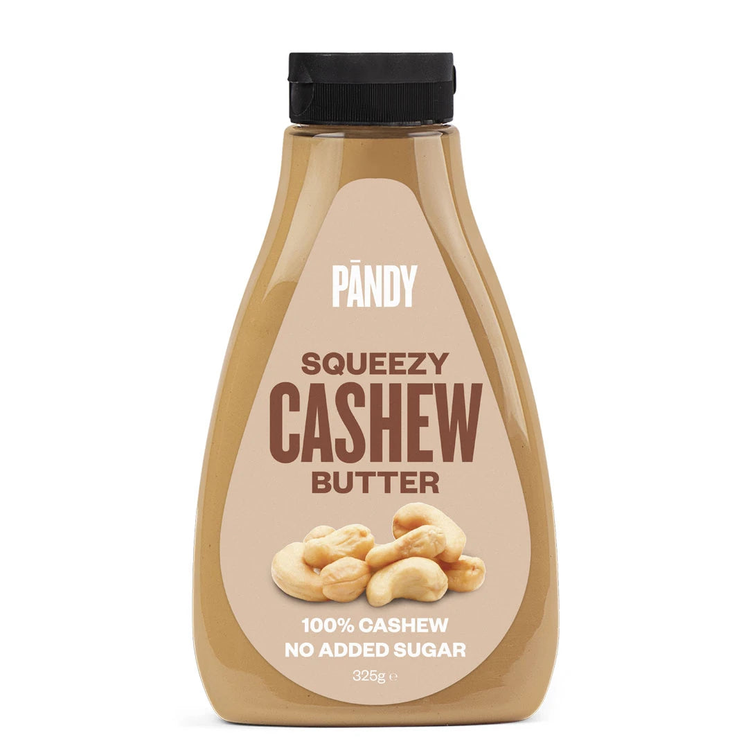 Pändy Squeezy 325 g i smaken Cashew Butter i en genomskinlig squeeze-flaska med beige etikett.