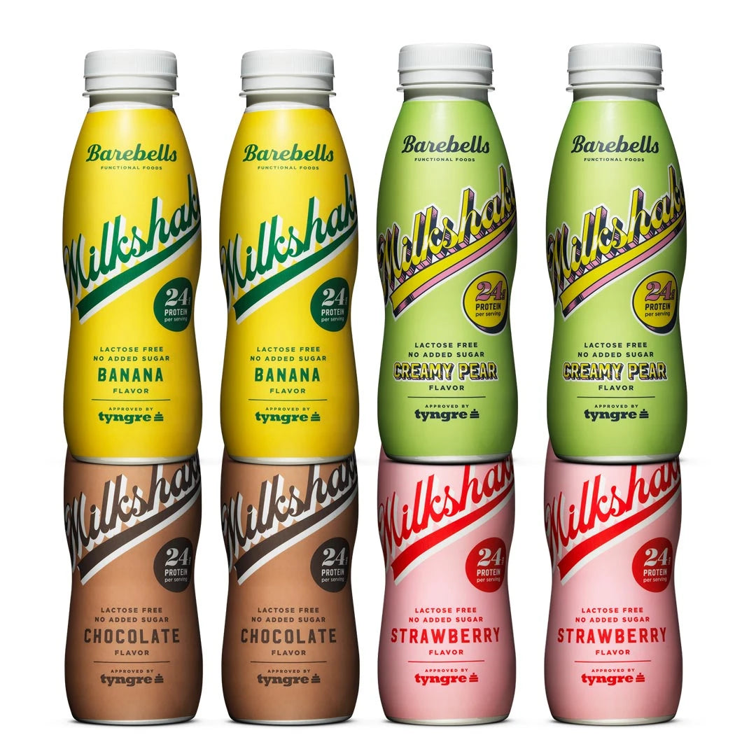 8 x Barebells Milkshake 330 ml Mixflak med åtta plastflaskor i smakerna Banana, Creamy Pear, Chocolate och Strawberry.