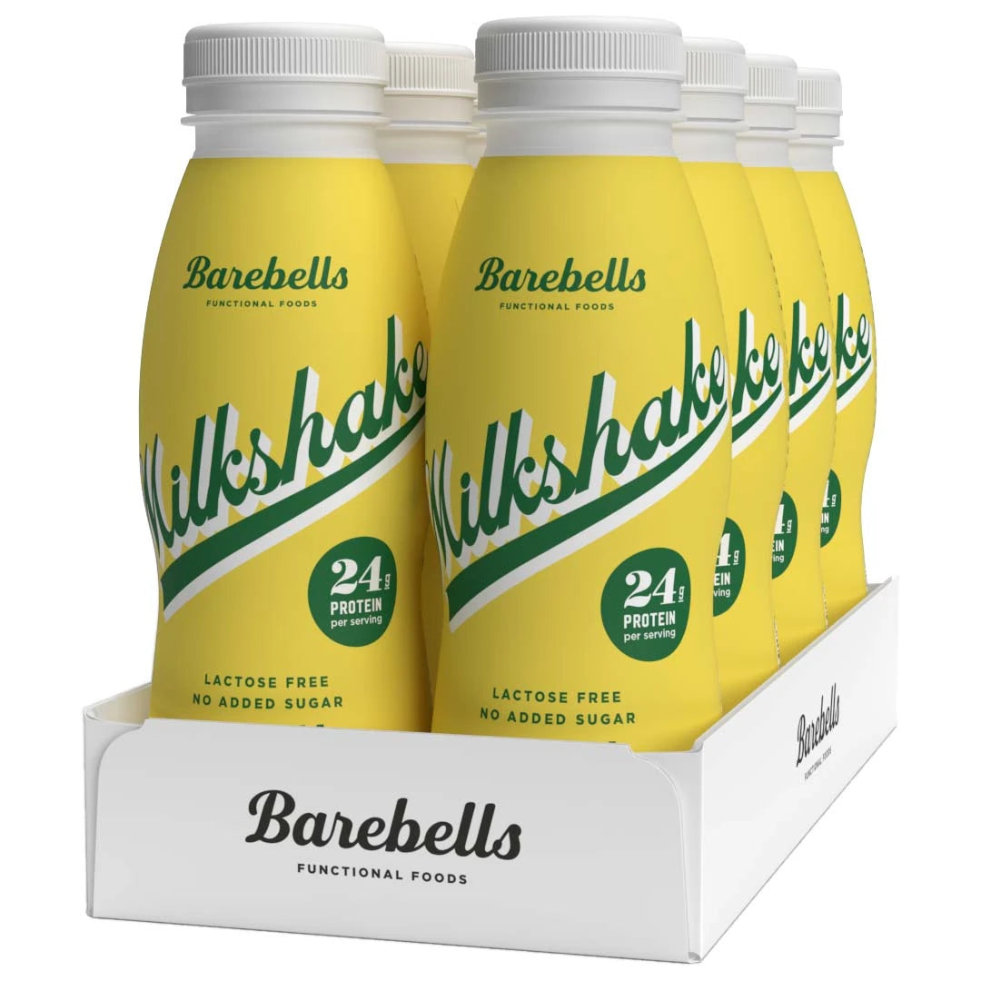 8 x Barebells Milkshake 330 ml Banana i gula flaskor med grön text samlade i ett vitt flak.