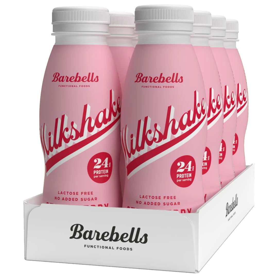 8 x Barebells Milkshake 330 ml Strawberry i en vit kartong med rosa flaskor och röda detaljer.