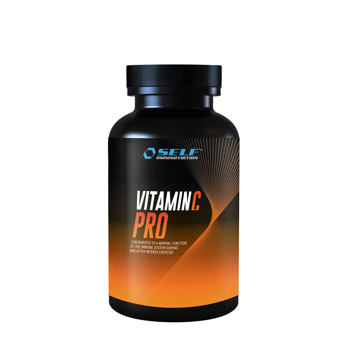 Self Omninutrition Vitamin C PRO 100 Tabs, kosttillskott förpackat i en svart burk med orangea detaljer.