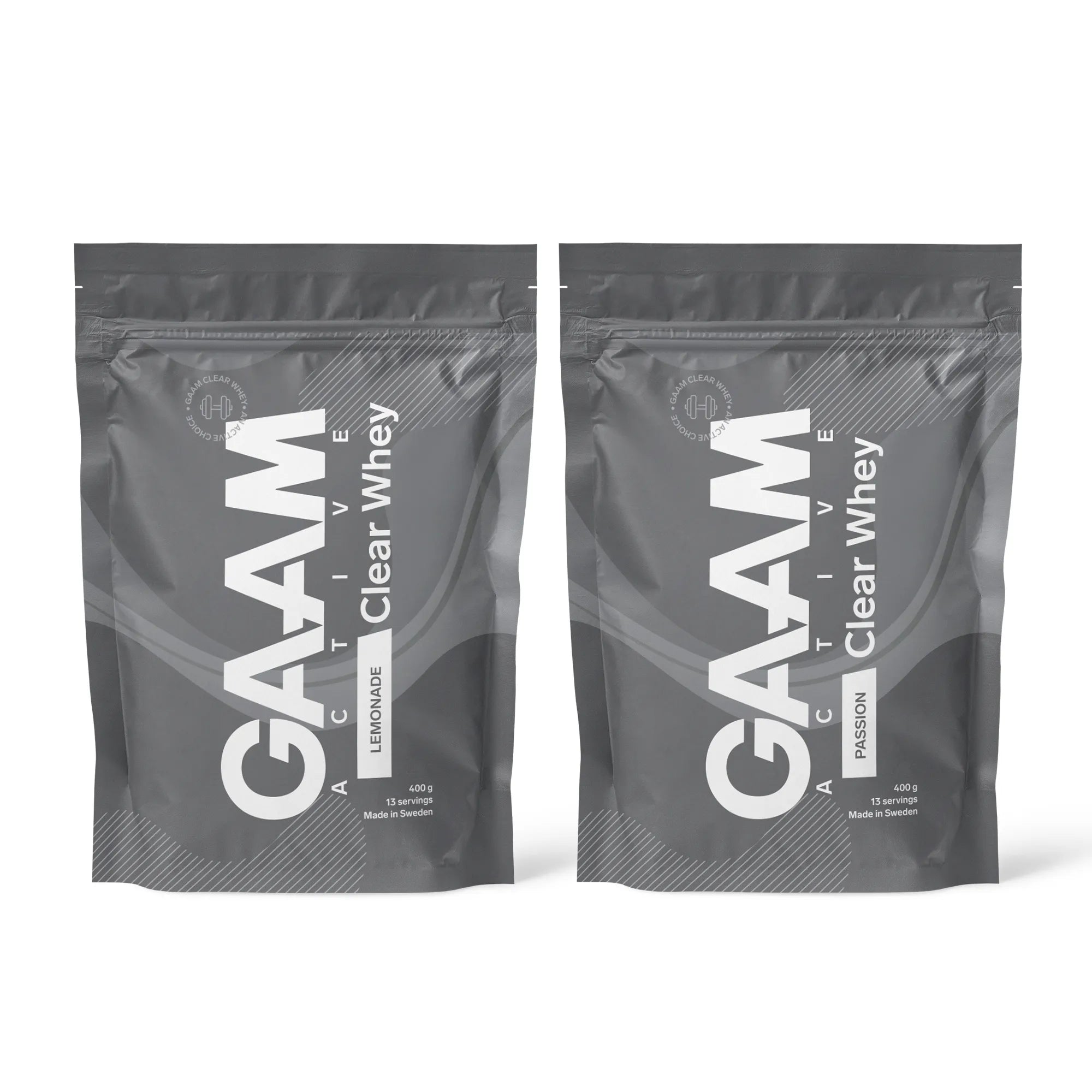 2 x GAAM Active Clear Whey Proteinpulver 400 g i två mörkgråa påsar för smakerna Lemonade och Passion.