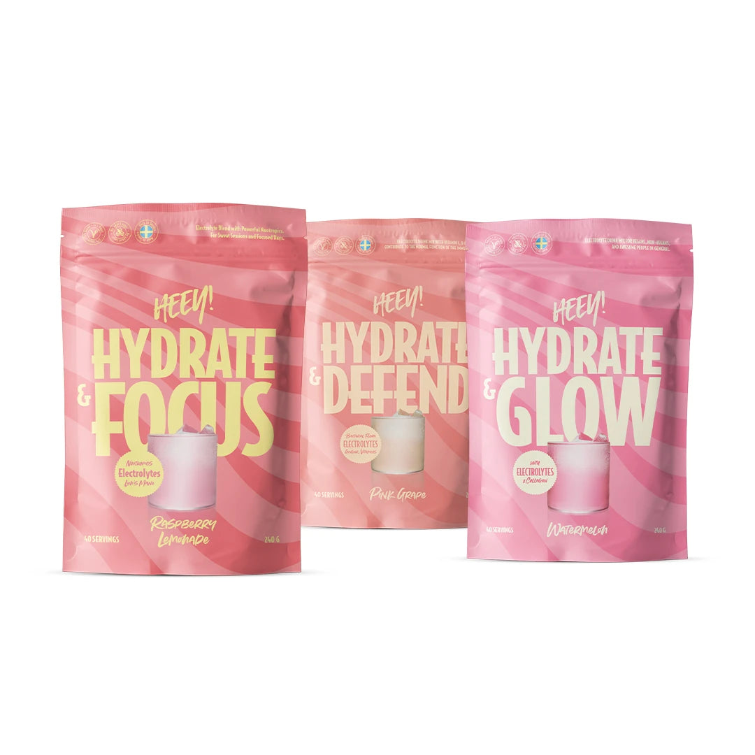 Heey! Hydration paket bestående av tre rosa och persikofärgade påsar med elektrolytpulver för olika behov.