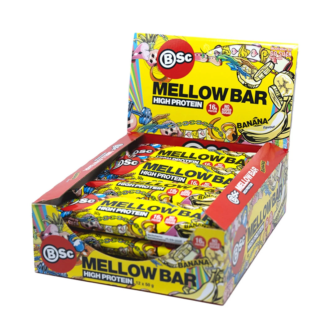 12 x BSc Mellow Bar 50 g Banana i en färgglad gul displaykartong med lekfulla illustrationer.