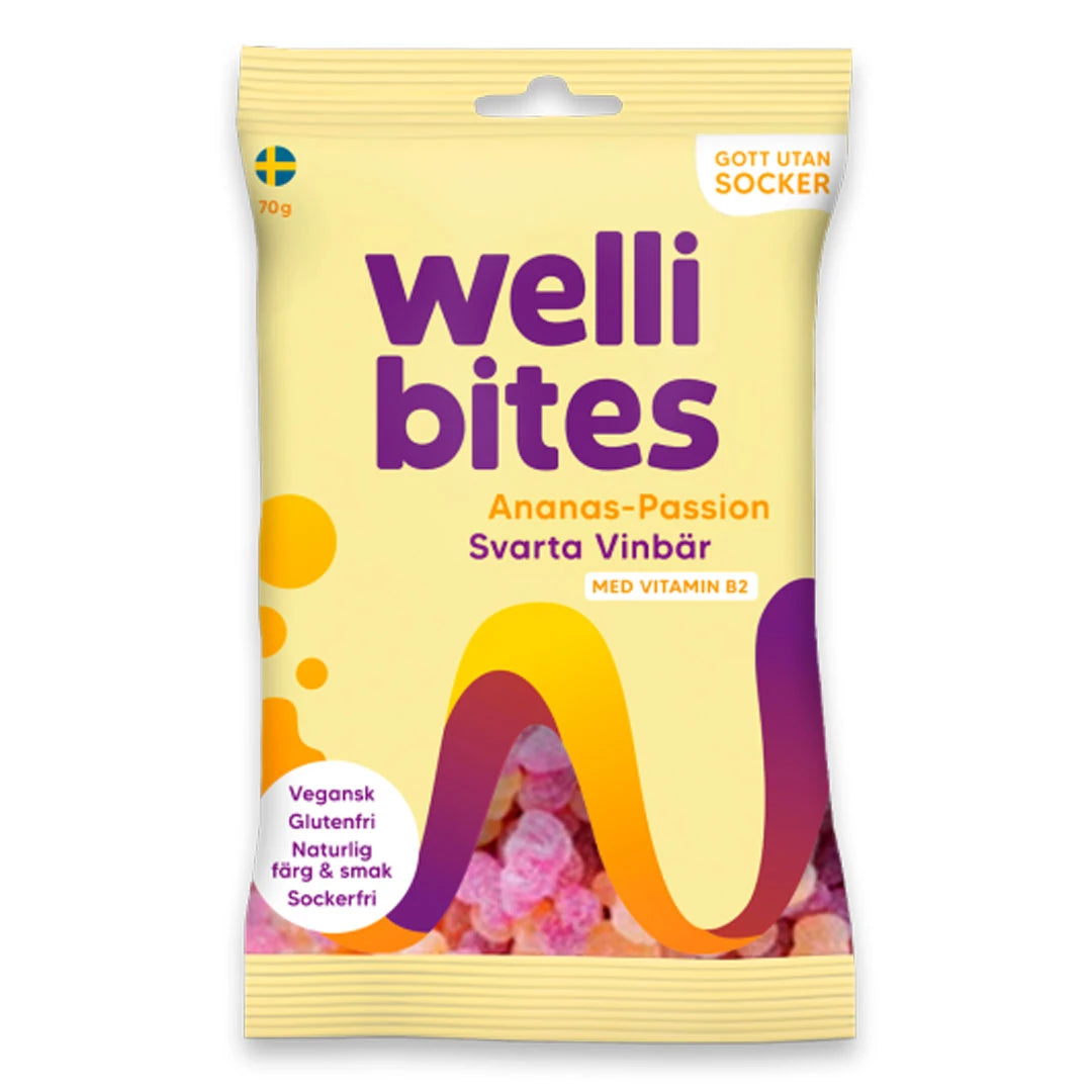 Wellibites Candy 70 g i en ljusgul påse med lila och orange detaljer för smaken Ananas-passion &amp; svarta vinbär., bild 9 av 12
