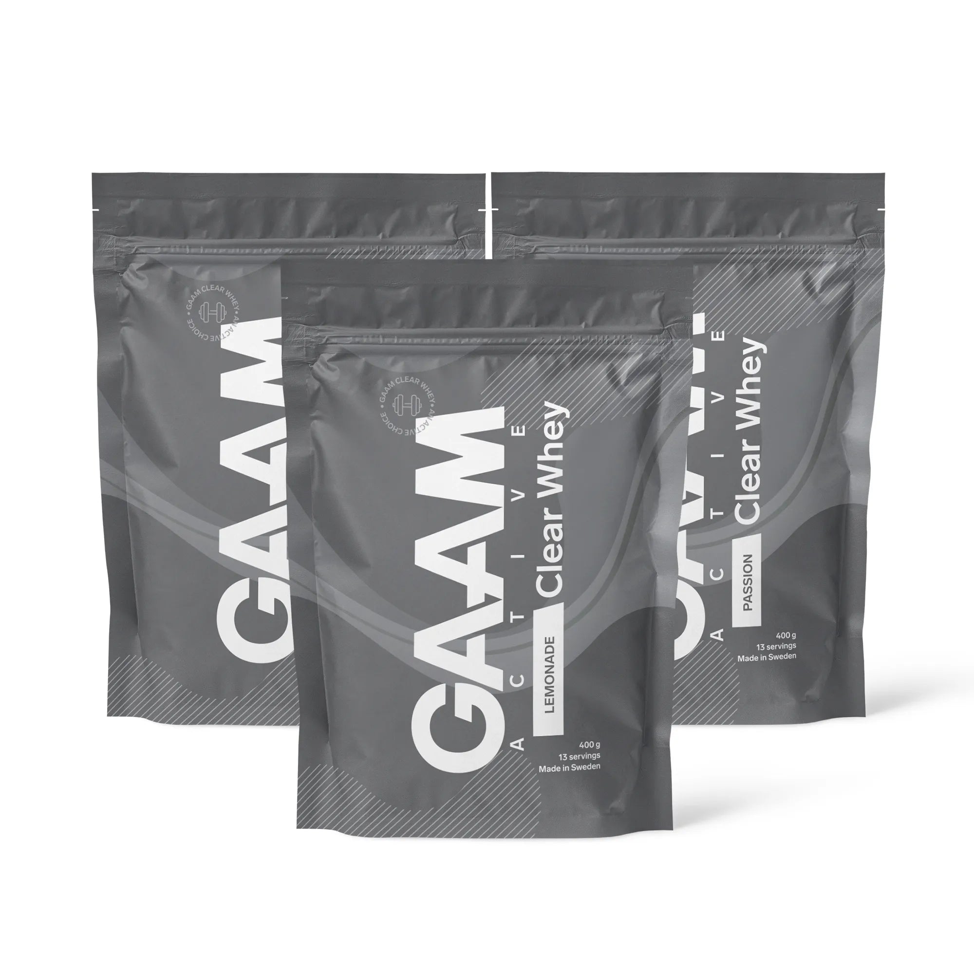 3 x GAAM Active Clear Whey Proteinpulver 400 g i gråa påsar med vit text för smakerna Lemonade och Passion.