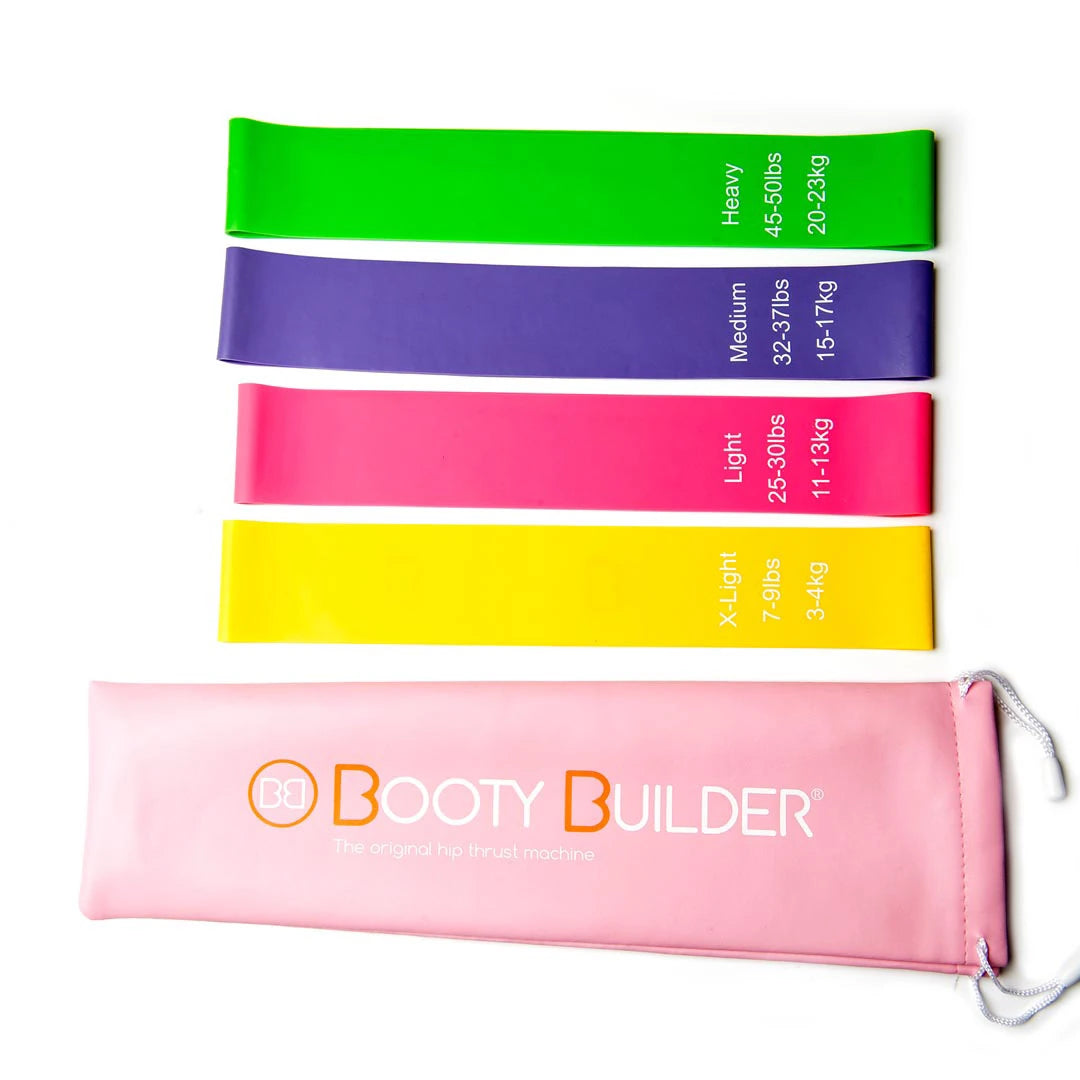 Booty Builder Mini Bands Pink 4-Pack med träningsband i fyra färger och en praktisk rosa förvaringspåse.