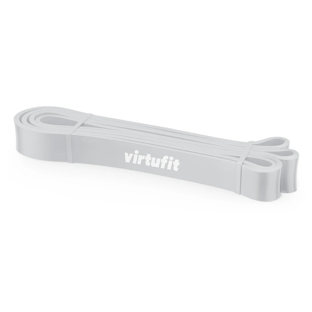 Ljusgrått träningsband med vit logga av modellen Virtufit Power Band Extra Light för uppvärmning och styrketräning.