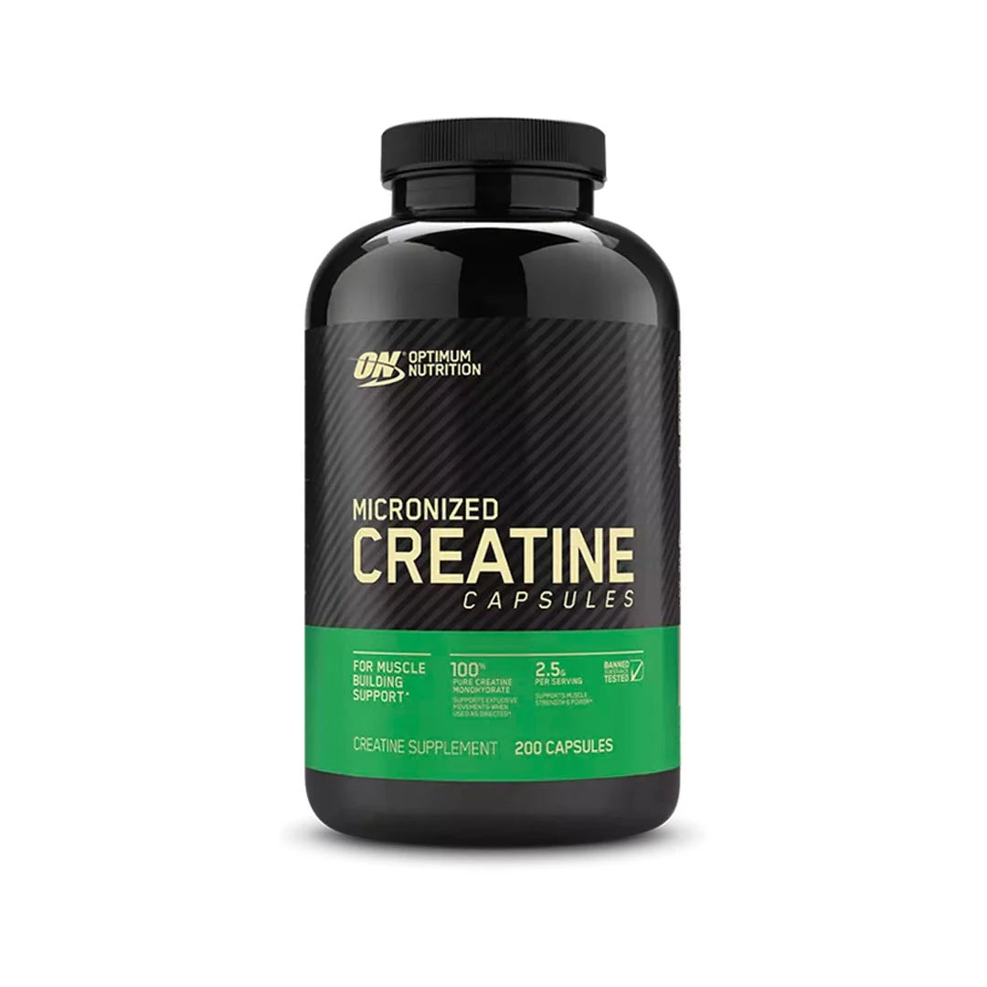 Optimum Nutrition Creatine Capsules 200 caps i en svart burk med grön etikett.