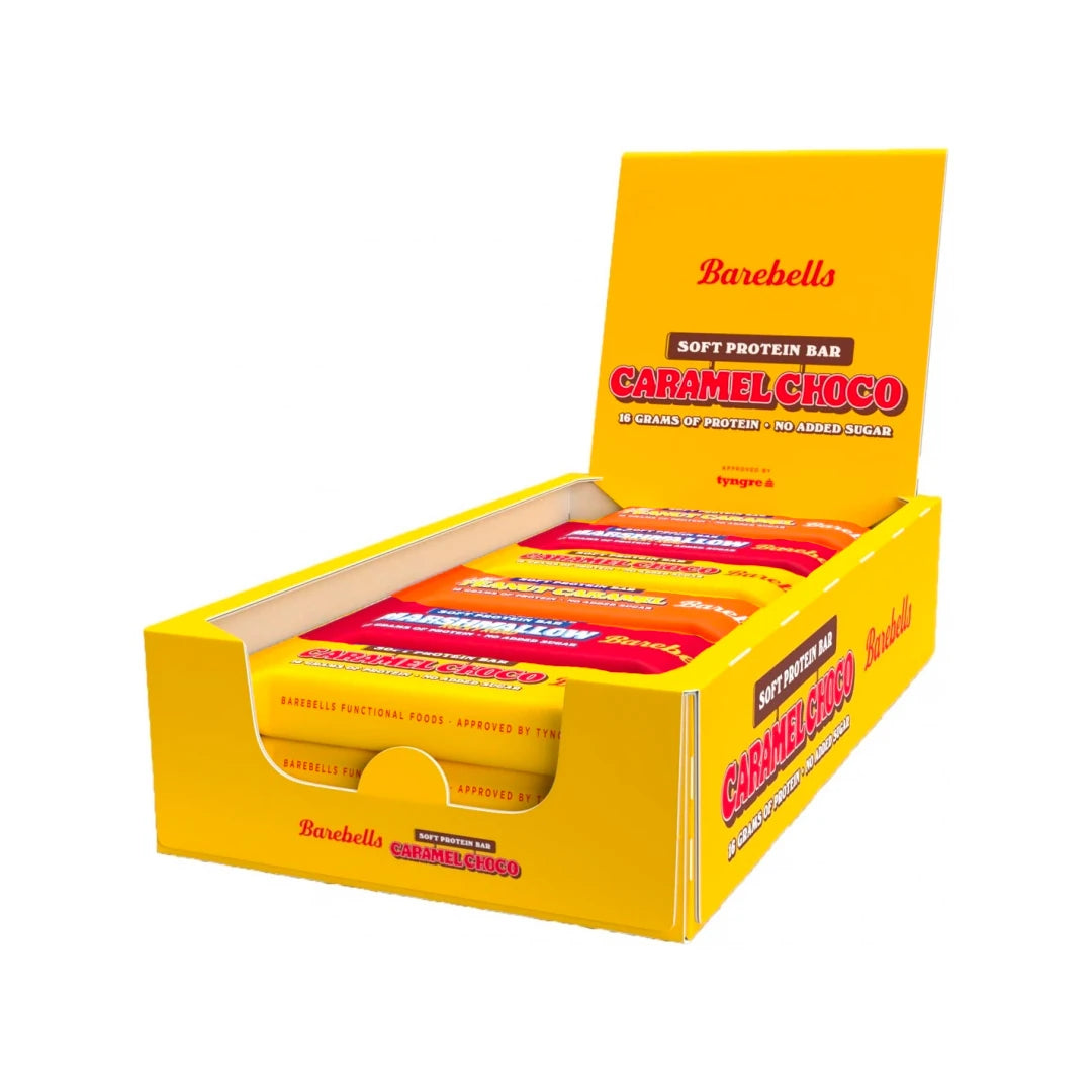12 x Barebells Soft / Protein Bar Mixlåda 55 g i en öppen gul displaylåda fylld med olika smaker.